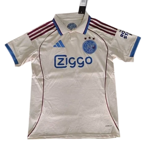 IVO Ajax soccer jersey in off-white with maroon stripes, blue trim, team crest, and sponsor logo on breathable fabric.