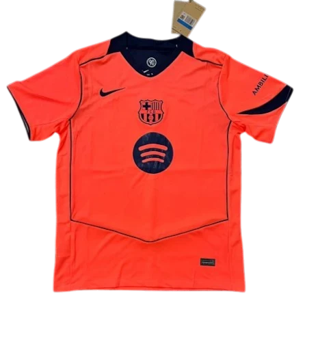 IVO FC Barcelona performance soccer jersey in vibrant orange with navy blue accents, team crest, and sponsor logos.