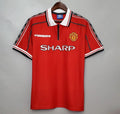 IVO vintage Manchester United red soccer jersey with white polo collar and Umbro diamond sleeve taping