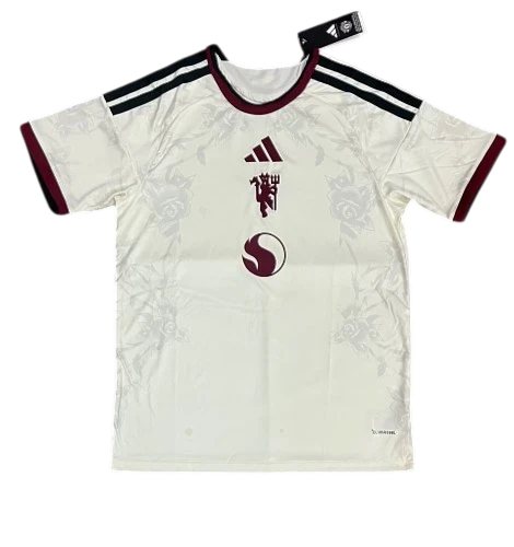 IVO professional soccer jersey in off-white with maroon accents, floral pattern, and team crest on breathable fabric.